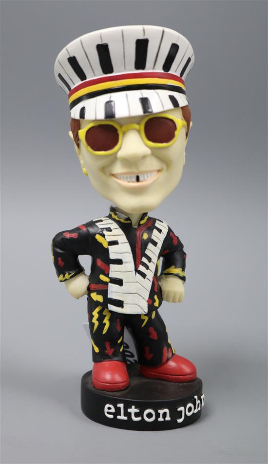 An Elton John bobble head